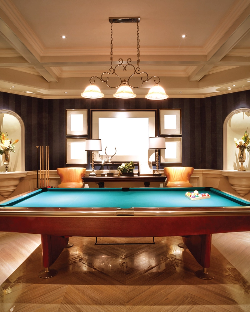 The clubhouse lounge with billiards table and panelled walls